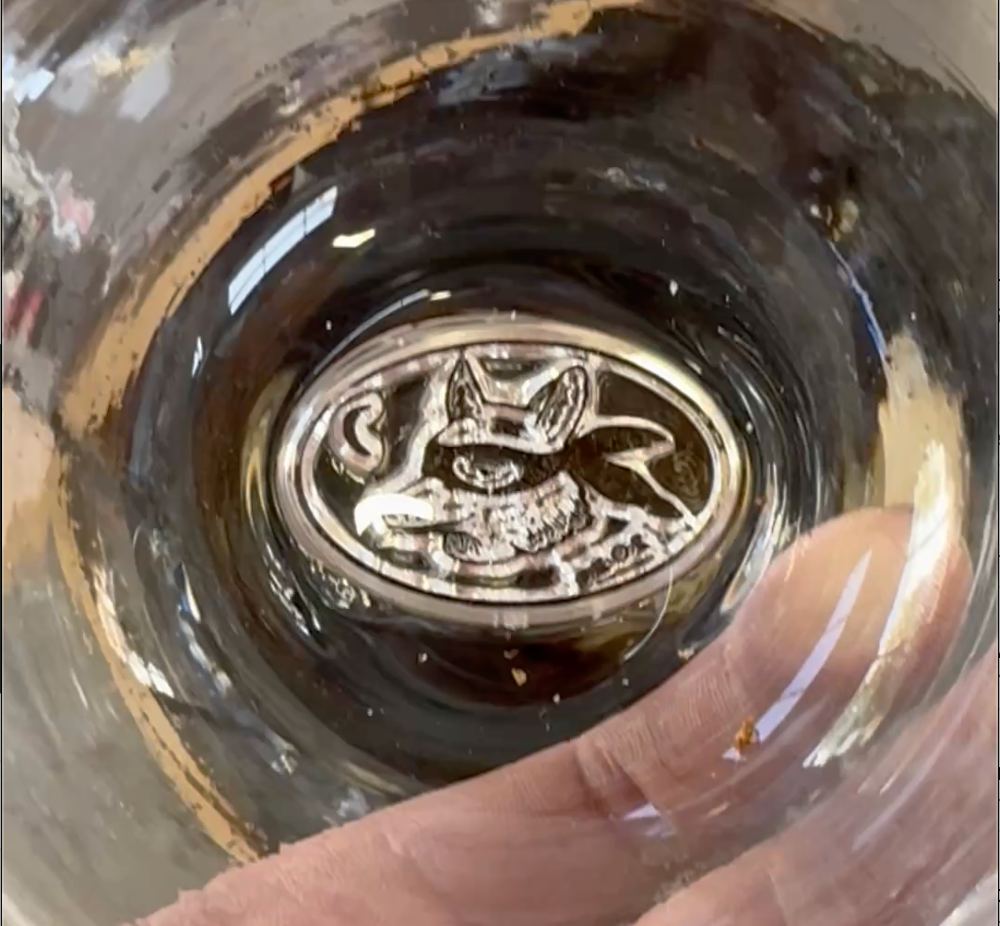 The Field fox and moon stamp pressed into the bottom of a glass